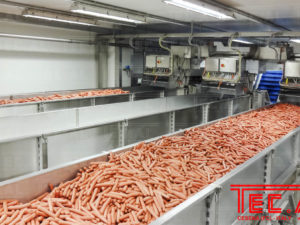 ACCUMULATION BUFFER FOR PEELED FRANKFURTERS